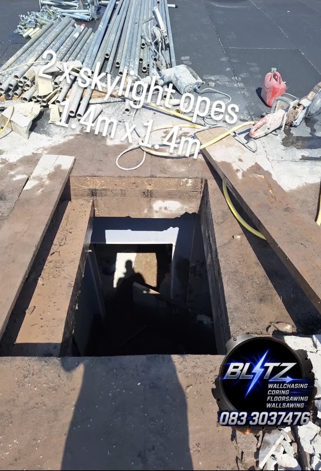 Two skylight openings cut through flat roof — Cork