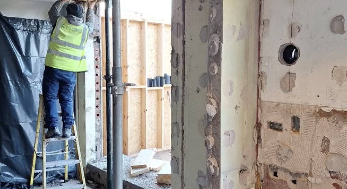 Blitz operative forming a large structural opening through a reinforced concrete wall in Cork